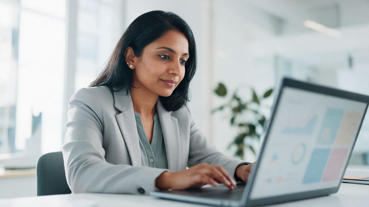 HR manager reviewing an HR software dashboard